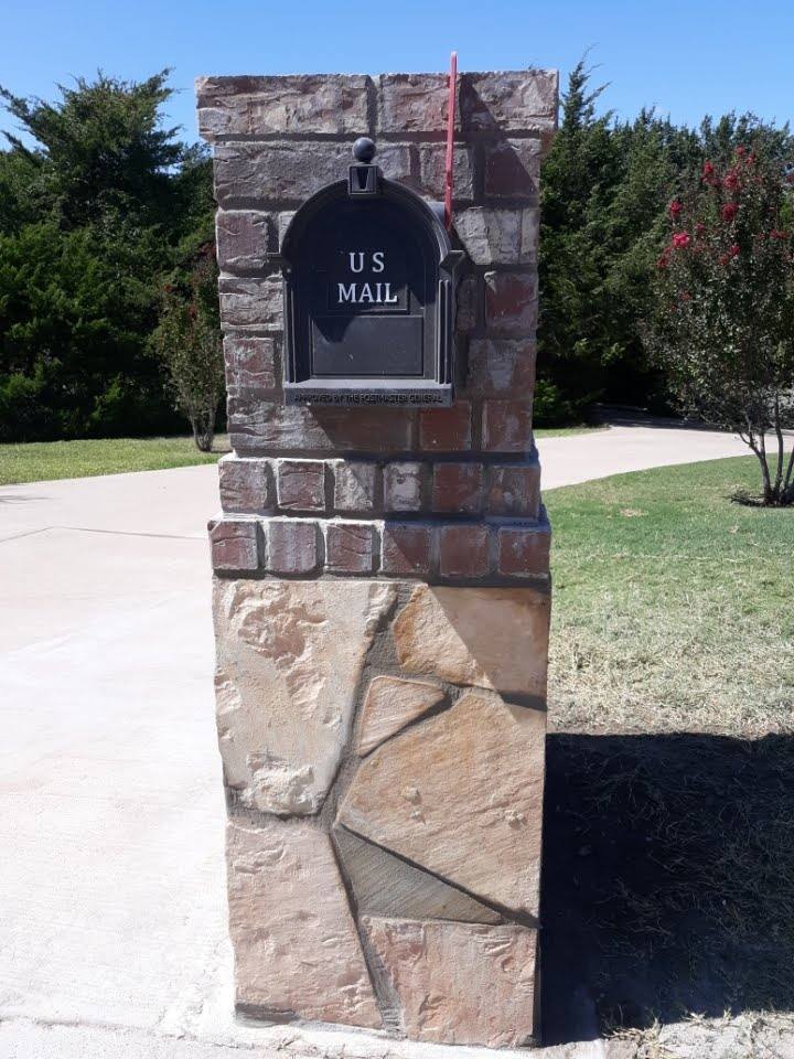 Mailbox run over and flattened on curb